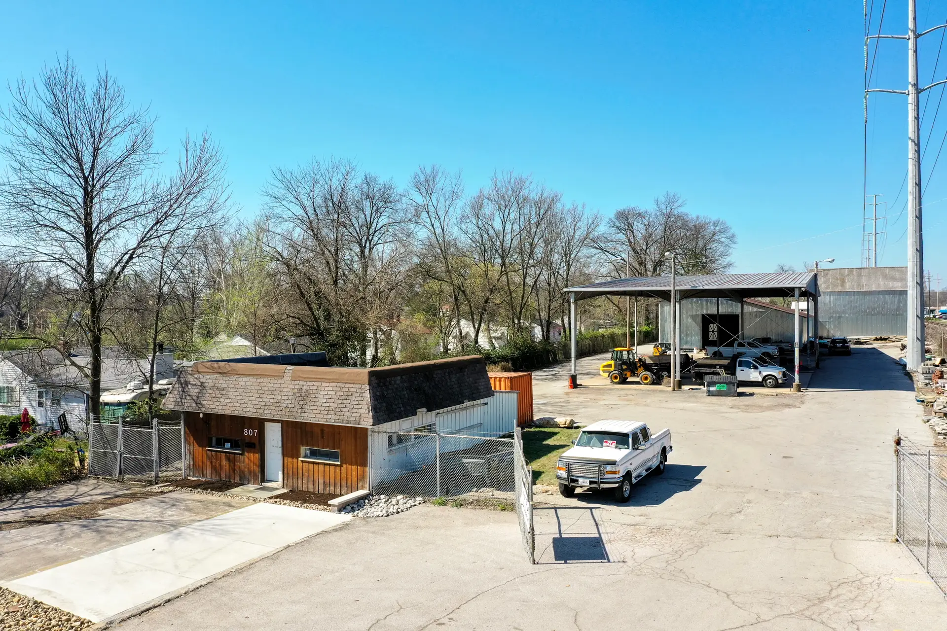 Photo of the office building and covered storage at 807 S Fillmore Ave.
